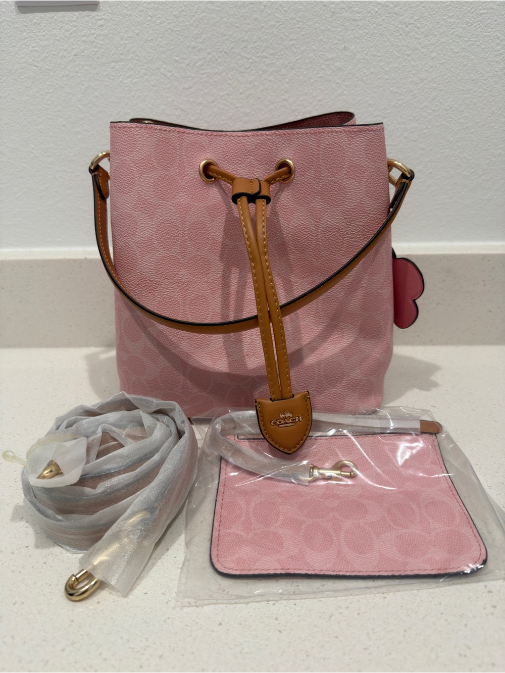 Coach Pink Signature Drawstring Bucket Bag with Tan Trim and Wristlet